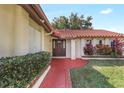 Inviting front entrance with a well-manicured lawn and vibrant plants at 8218 Borgia Ct, Orlando, FL 32836