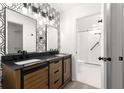 Updated bathroom with dual vanity, modern fixtures, and a glass-enclosed shower at 11643 Sw 137Th Loop, Dunnellon, FL 34432