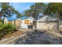 This property features a driveway leading to a detached garage at 1349 Arlington St, Orlando, FL 32805