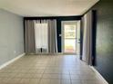 Bright and airy living room with tile floors and natural light at 1416 Braebury Dr, Leesburg, FL 34748