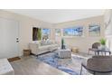 Cozy living room featuring a comfortable white sofa, modern furnishings, and bright natural light at 2814 Bonneville Dr, Orlando, FL 32826