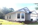 Beautiful home with large bay windows and lush green lawn at 5509 Florence Harbor Dr, Orlando, FL 32829