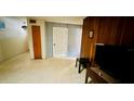Spacious living room with wood paneled walls, offering lots of natural light at 6429 Voltaire Dr, Orlando, FL 32809