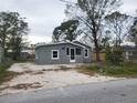 Quaint home boasting a freshly painted exterior, tidy front yard, and inviting curb appeal at 1303 37Th Nw St, Winter Haven, FL 33881