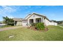 Beautiful single Gathering home with well-manicured lawn and lovely landscaping for great curb appeal at 1619 Leatherback Ln, St Cloud, FL 34771