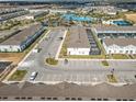 Aerial view showing the community's amenities, including a pool and parking, ideal for a relaxed lifestyle at 201 Jetty Way, Davenport, FL 33897