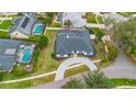 Expansive property featuring a meticulously landscaped yard and a private backyard swimming pool at 6229 Indian Meadow St, Orlando, FL 32819