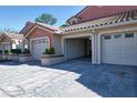 View of the garages; home featuring a convenient two-car garage and well-maintained exterior landscaping at 7449 Sugar Bend Dr # 7449, Orlando, FL 32819