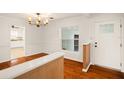 Bright dining room featuring hardwood floors, and stylish chandelier at 1307 Lindenwood Ln, Winter Park, FL 32792