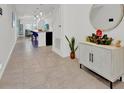 Inviting entry hall featuring tile flooring, modern decor, and an open view into the living spaces at 2117 Trani Ter, St Cloud, FL 34771