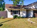 Inviting single-Gathering home with green lawn, dark shutters, and walkway at 2600 Musselwhite Ave, Orlando, FL 32804