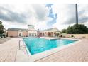 A refreshing community pool with comfortable lounge chairs, and a clubhouse, perfect for relaxation and recreation at 3177 Feltrim Pl # 304, Kissimmee, FL 34747