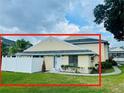 Charming condo exterior with well-maintained lawn, a front door and white picket fence for privacy at 4439 Pinebark Ave # 47-4, Orlando, FL 32811