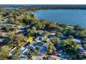 Aerial view of home in a neighborhood near a large lake at 605 Hill Ave, Ocoee, FL 34761