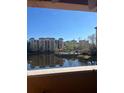 Condominium complex featuring a pool and gazebo, as seen from a balcony at 12521 Floridays Resort Dr # 206F, Orlando, FL 32821