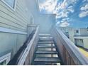 Exterior stairs leading to apartments on a bright sunny day at 166 Scottsdale Sq # 166, Winter Park, FL 32792