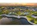 Community with a recreational pool, clubhouse, and landscaping around a scenic lake at 1507 Carey Palm Cir, Kissimmee, FL 34747