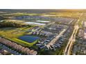 Expansive aerial view of a residential community featuring ponds and well-maintained streets at 1507 Carey Palm Cir, Kissimmee, FL 34747