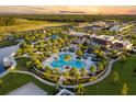 Aerial view of a stunning resort-style pool with palm trees and various amenities at 1507 Carey Palm Cir, Kissimmee, FL 34747