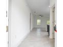 Inviting foyer featuring neutral tile flooring and an open view into the living spaces at 16893 Sw 17Th Ter, Ocala, FL 34473