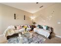 Cozy living room featuring comfortable seating, a modern rug, decorative accents, and ambient lighting at 2080 Switch Grass Cir, Ocoee, FL 34761