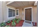 Inviting front door with a cozy front porch and a welcoming landscaped yard at 615 Richland Ct # 61, Altamonte Springs, FL 32714