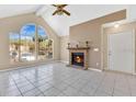 Spacious living room with a fireplace, high ceilings, and a view from large windows at 615 Richland Ct # 61, Altamonte Springs, FL 32714