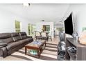 Bright and airy living room featuring a comfortable seating area and an open layout, perfect for modern living at 12100 Calaboose Ct, Orlando, FL 32828