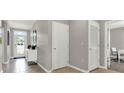 Hallway view with decorative console table and adjacent office space at 2801 Jamaica Way, Haines City, FL 33844