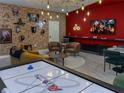 Game room featuring a brick wall, Harry Potter decor, and an air hockey table at 2904 Penelope Loop, Kissimmee, FL 34746