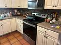 Picture of kitchen with stainless steel appliances, wood cabinets, and tile backsplash at 491 Grandview Ave, Ormond Beach, FL 32176