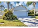 Charming single-story home features a well-manicured lawn and an attached two-car garage at 515 Mickleton Loop, Ocoee, FL 34761