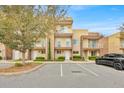 Contemporary townhouse boasts three stories, glass-enclosed balconies, and reserved parking spaces at 7661 Recife Dr, Kissimmee, FL 34747