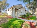 Attractive home with a manicured lawn, fresh mulch, and a clean walkway leading to the inviting front entrance at 3967 Campfire Way, Casselberry, FL 32707