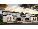 Street view of modern two-story homes with white stucco, black trim, and attached garages at 405 Calhoun Pl, Orlando, FL 32801