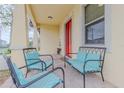 Inviting front porch featuring comfortable seating, perfect for relaxing and enjoying the neighborhood view at 410 South Hudson St, Orlando, FL 32835