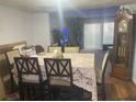 Formal dining room boasts wood floors, a large decorative dining table and an antique grandfather clock at 4419 S Semoran Blvd # 7, Orlando, FL 32822