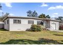 Inviting single Gathering home with a well-manicured lawn and shade trees at 4521 Jim Glenn Dr, Orlando, FL 32808