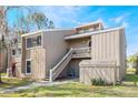 Charming condo with two stories and a stairway, surrounded by lush greenery and a serene landscape at 5842 Peregrine Ave # C01, Orlando, FL 32819