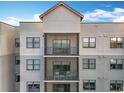 Exterior elevation of condo building with a private balcony, perfect for enjoying the outdoor scenery and fresh air at 14501 Grove Resort Grove Resort Ave # 3733, Winter Garden, FL 34787
