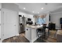 Bright kitchen with granite countertops, stainless steel appliances, and a functional island at 149 E Muriel St, Orlando, FL 32806