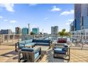 Modern rooftop lounge area with comfortable outdoor seating and scenic views of the city skyline at 150 E Robinson St # 209, Orlando, FL 32801