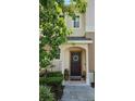 Beautiful front entryway featuring an inviting dark wood door with decorative wreath at 554 Pinebranch Cir, Winter Springs, FL 32708