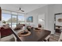 Bright dining room with large windows, modern fan, and view of the pool deck at 101 S Eola Dr # 509, Orlando, FL 32801