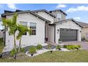 Beautiful home with a well-maintained lawn and updated landscaping at 1240 Lone Palm Way, St Cloud, FL 34771