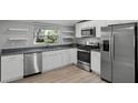 Modern kitchen featuring stainless steel appliances and ample countertop space at 144 Delespine Dr, Debary, FL 32713