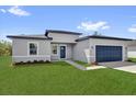Beautiful one story home with a two car garage and landscaped yard at 166 Marion Oaks Ln, Ocala, FL 34473