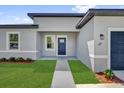 Close up of the front of the home showing the well manicured lawn at 166 Marion Oaks Ln, Ocala, FL 34473