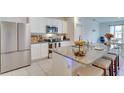 Modern kitchen with stainless steel appliances, granite countertops, and a breakfast bar with seating at 1750 Eagle Hammock Blvd, Eagle Lake, FL 33839