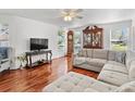 Spacious living room with hardwood floors and large windows at 2413 Tack Room Ln # 2, Orlando, FL 32812